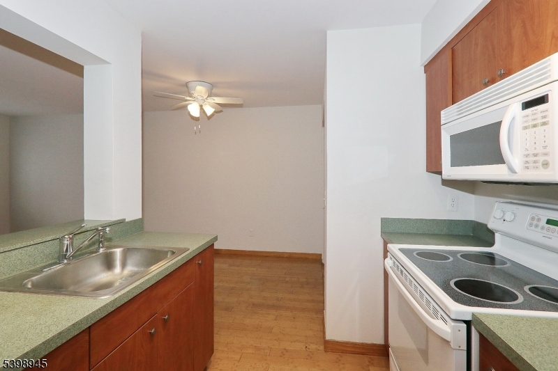 21 Parkside Road Bedminster, NJ 07921 - Photo 17 of 17 a kitchen with a sink stove and microwave