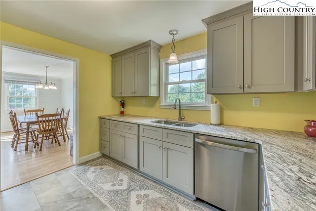 a kitchen with sink and cabinets