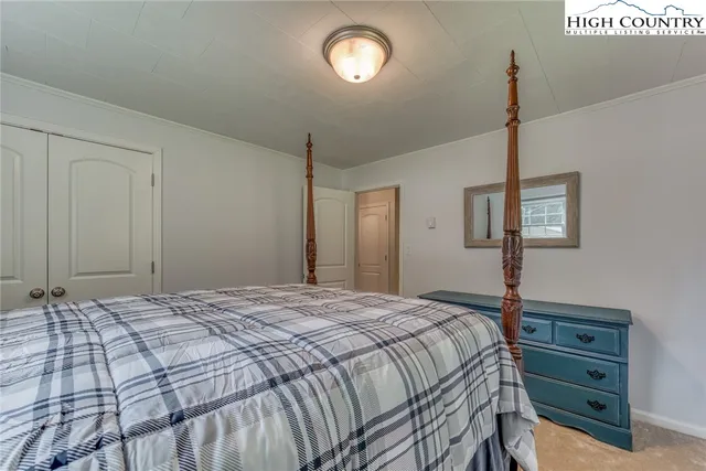 a bedroom with a bed and a table