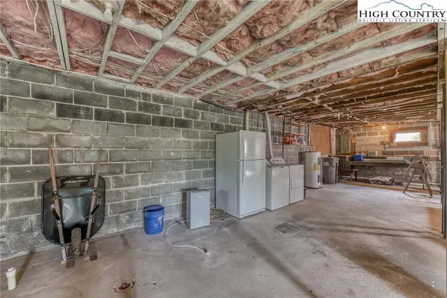 a view of a garage room with racks on the wall