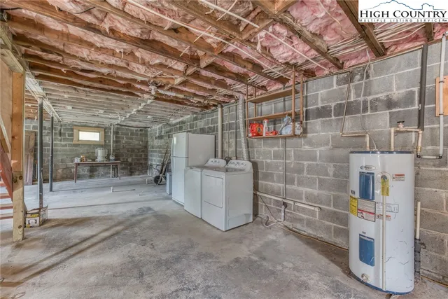 a backyard of a house with plants and large trees