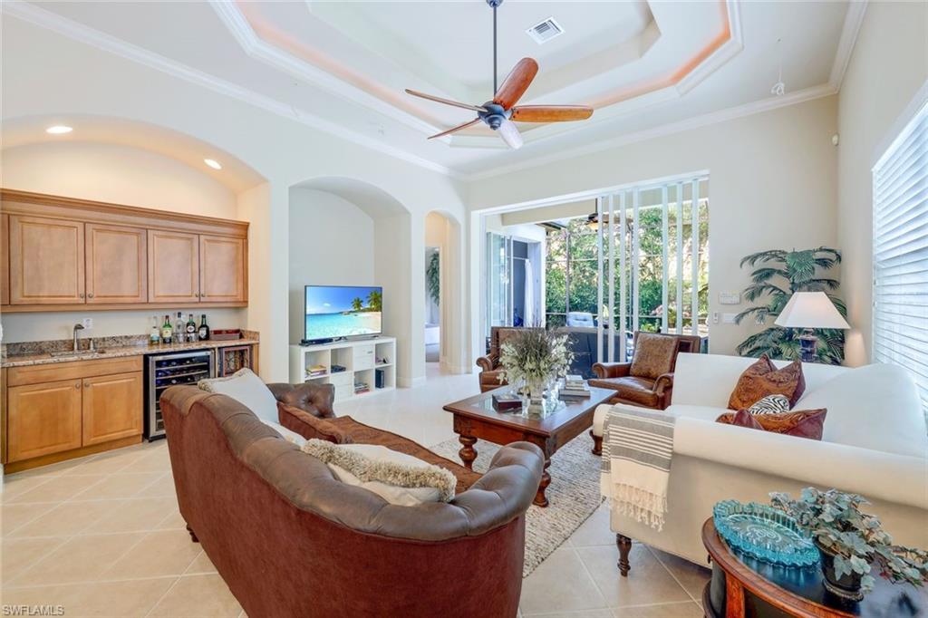 5797 Mango Circle, Unit 5797 Naples, FL 34110 - Photo 11 of 22 a living room with furniture fireplace and window
