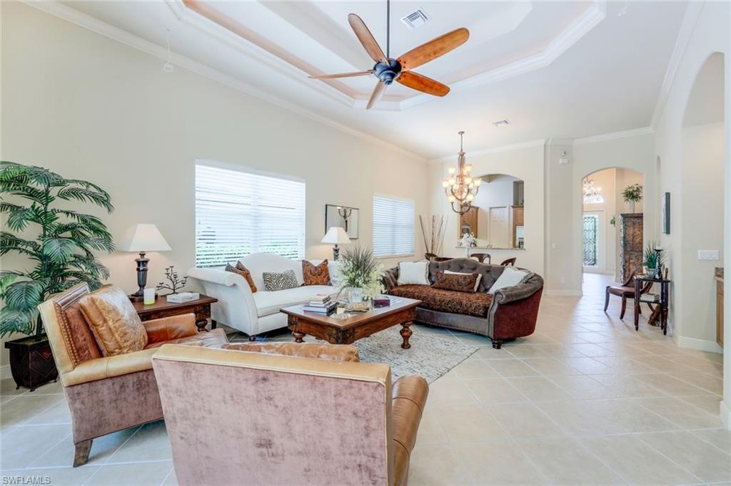 5797 Mango Circle, Unit 5797 Naples, FL 34110 - Photo 12 of 22 a living room with furniture and a large window