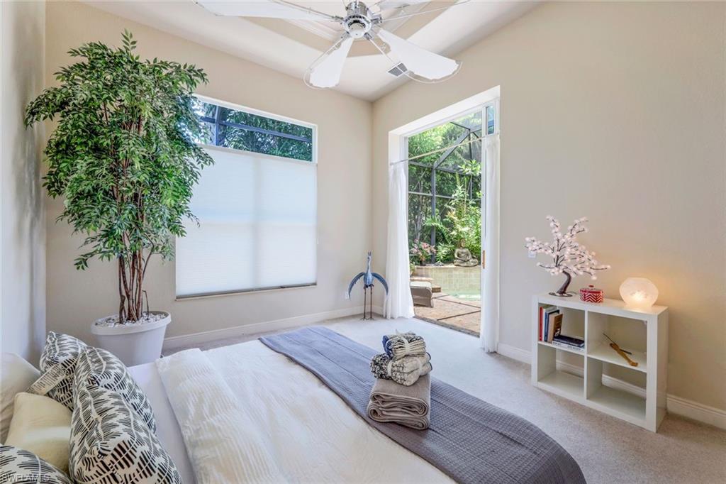 5797 Mango Circle, Unit 5797 Naples, FL 34110 - Photo 14 of 22 a living room with furniture and a large window