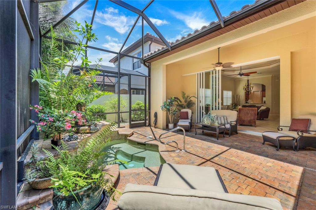 5797 Mango Circle, Unit 5797 Naples, FL 34110 - Photo 20 of 22 a view of a living room and dining room