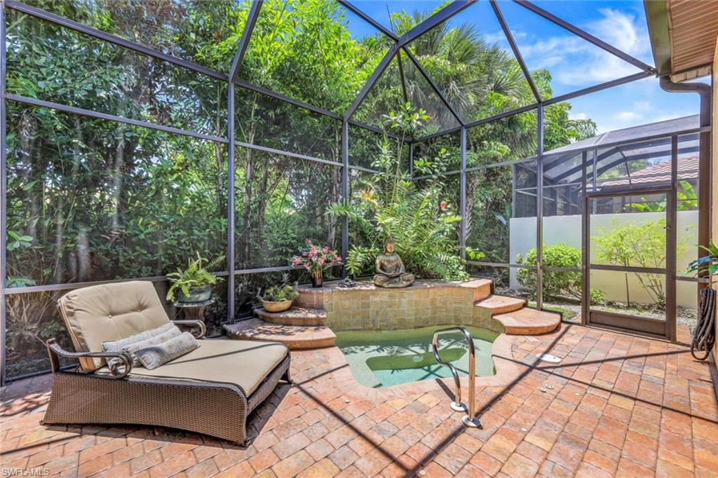 5797 Mango Circle, Unit 5797 Naples, FL 34110 - Photo 22 of 22 a view of backyard with seating space