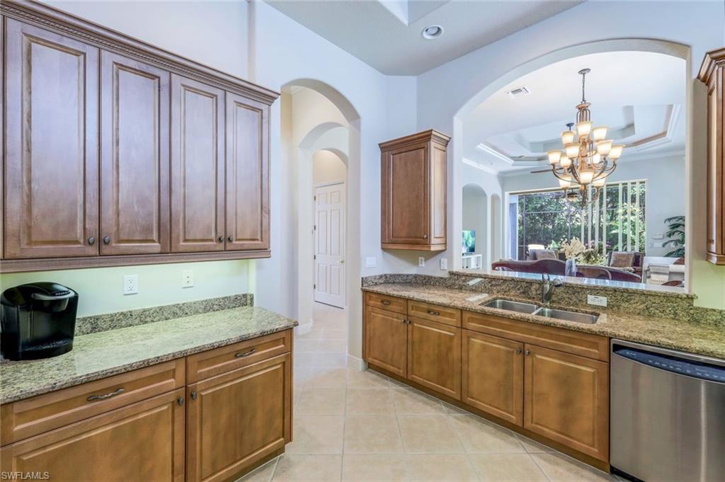 5797 Mango Circle, Unit 5797 Naples, FL 34110 - Photo 9 of 22 a spacious bathroom with a granite countertop sink a mirror and a