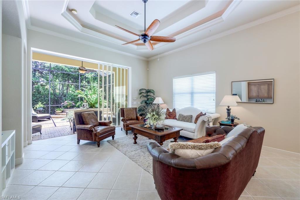 5797 Mango Circle, Unit 5797 Naples, FL 34110 - Photo 10 of 22 a living room with furniture and a large window
