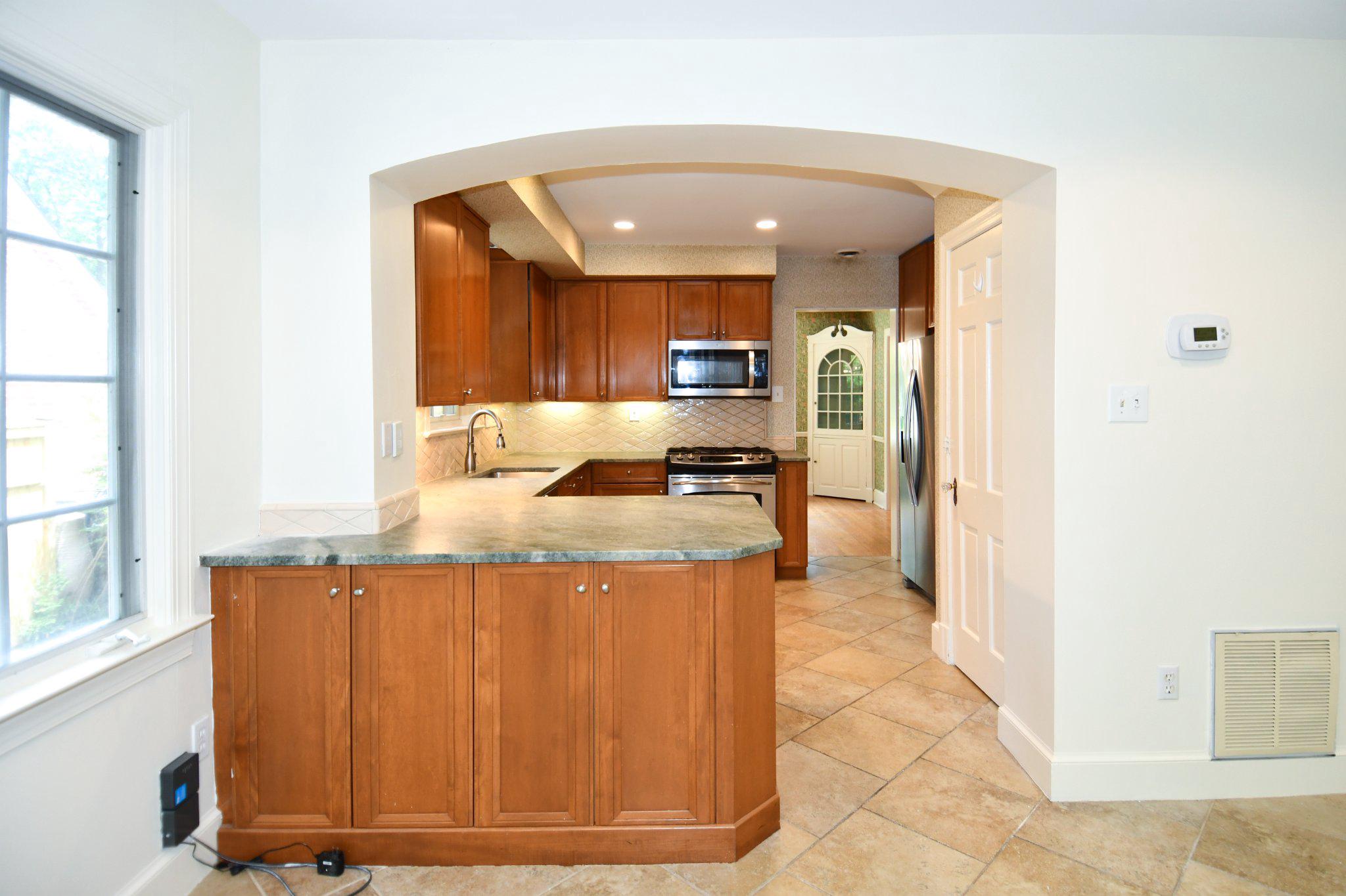 2608 Fordham Road Alexandria, VA 22302 - Photo 11 of 46 Modern kitchen with warm wood tones.