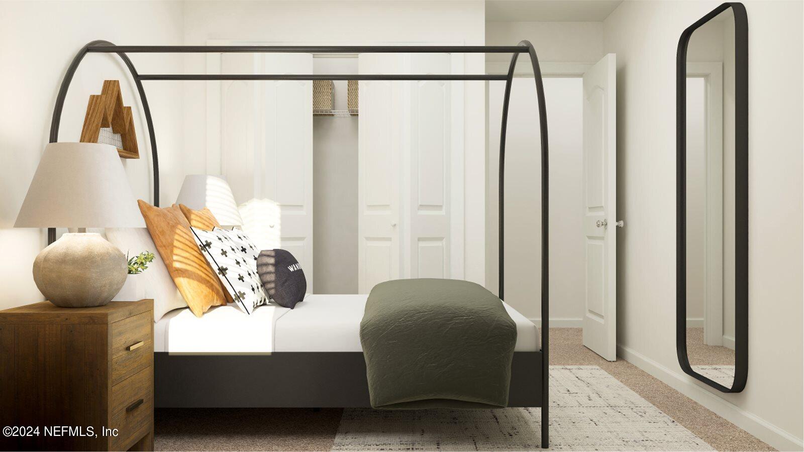 682 Holly Lakes Drive Orange Park, FL 32073 - Photo 14 of 19 a bedroom with a bed and a mirror