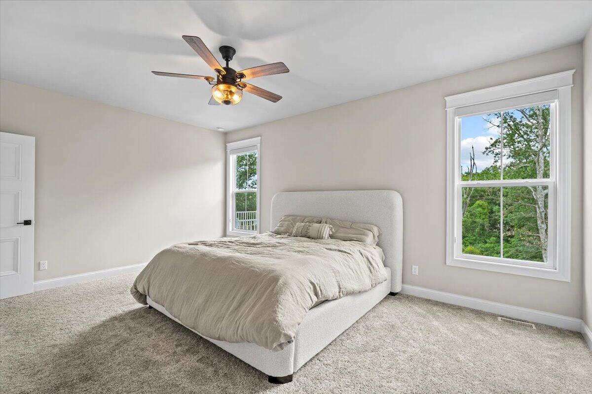 12893 Baker Court Crown Point, IN 46307 - Photo 18 of 52 a bedroom with a bed and window