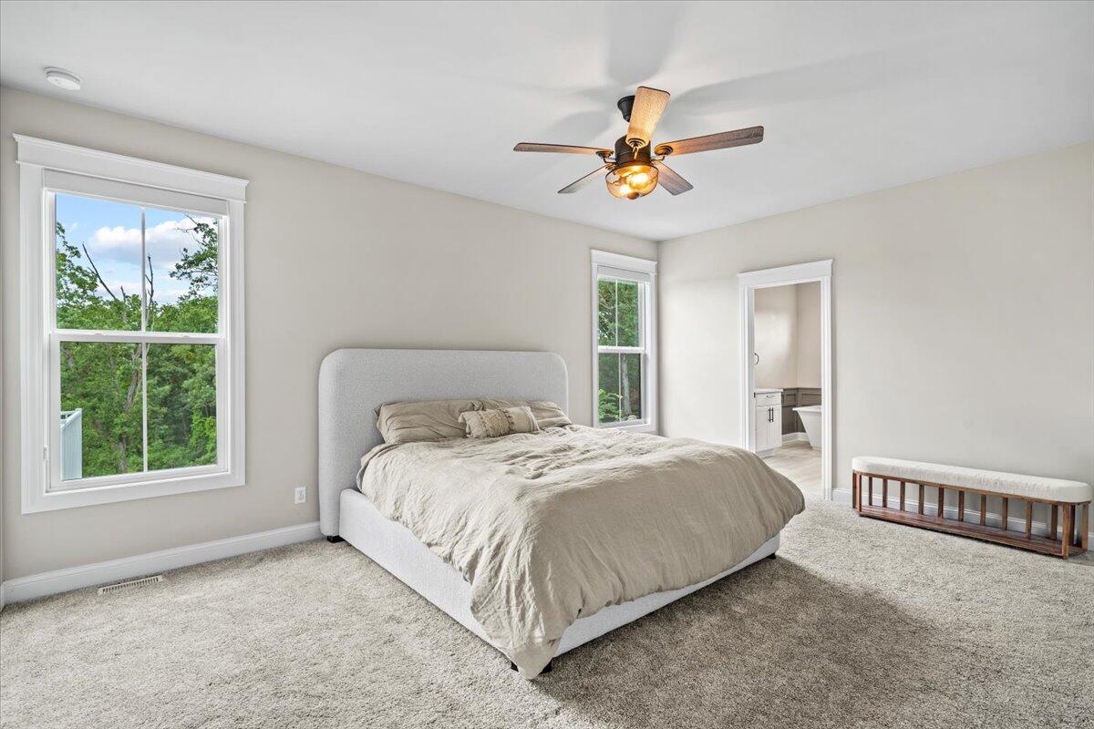 12893 Baker Court Crown Point, IN 46307 - Photo 19 of 52 a bedroom with a bed and a window