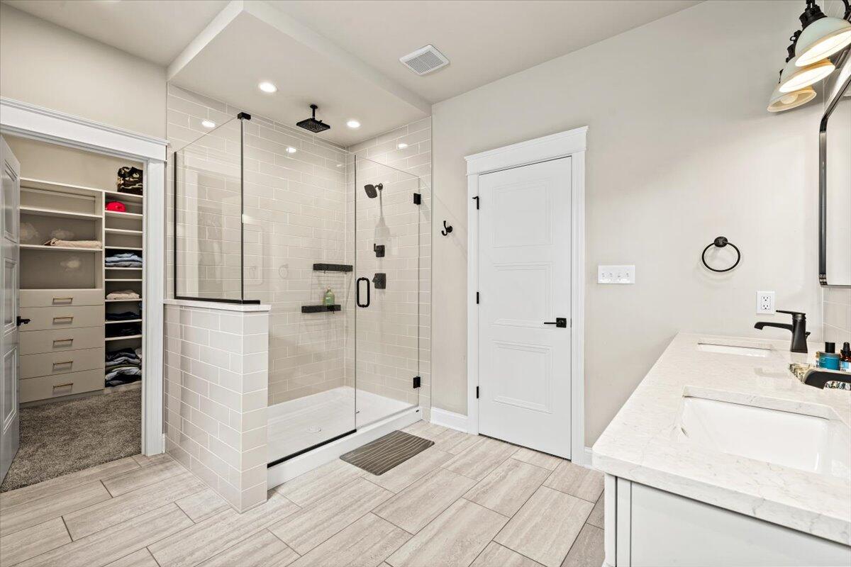 12893 Baker Court Crown Point, IN 46307 - Photo 21 of 52 a bathroom with a sink a shower and a mirror