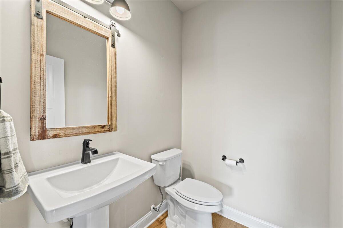 12893 Baker Court Crown Point, IN 46307 - Photo 26 of 52 a bathroom with a sink and a toilet