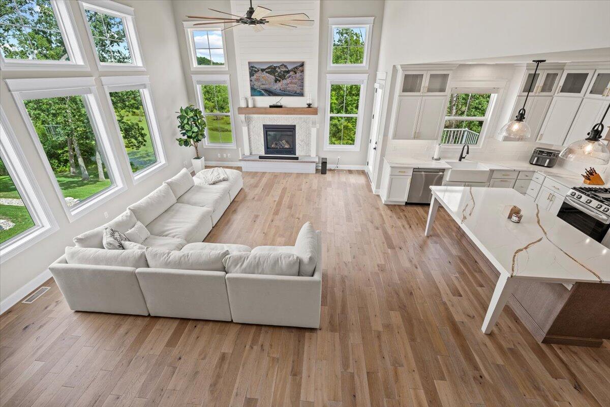 12893 Baker Court Crown Point, IN 46307 - Photo 27 of 52 a living room with furniture and a fireplace