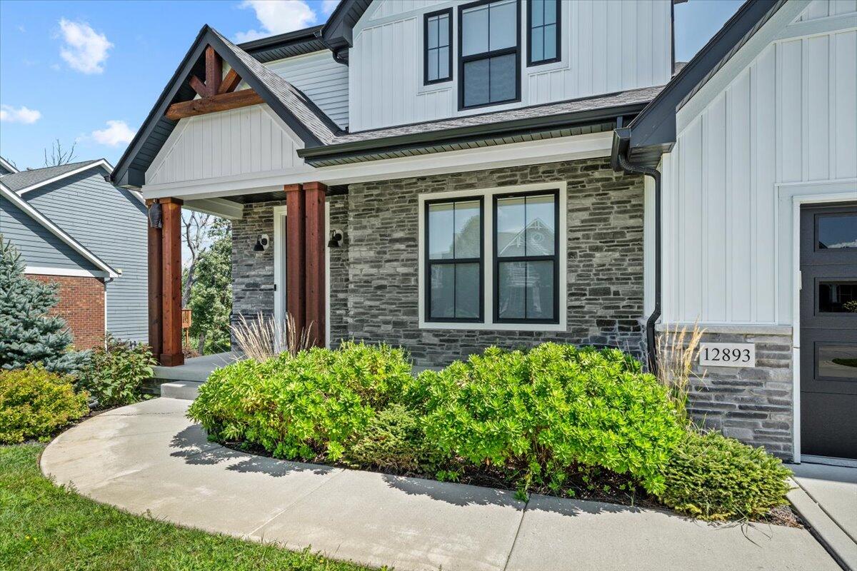 12893 Baker Court Crown Point, IN 46307 - Photo 3 of 52 a front view of a house with garden