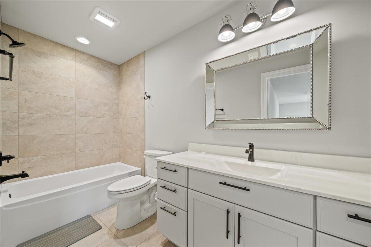 12893 Baker Court Crown Point, IN 46307 - Photo 31 of 52 a bathroom with a sink a toilet and a bathtub