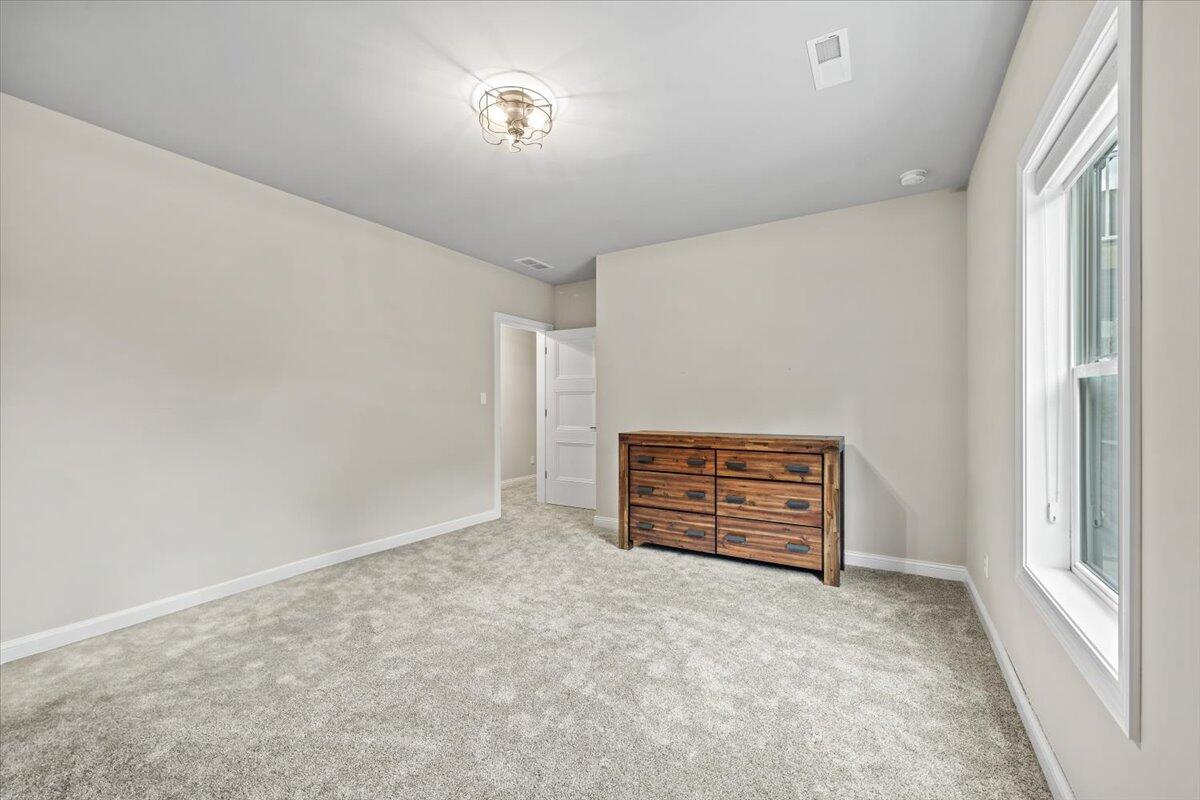 12893 Baker Court Crown Point, IN 46307 - Photo 39 of 52 an empty room with furniture and natural light