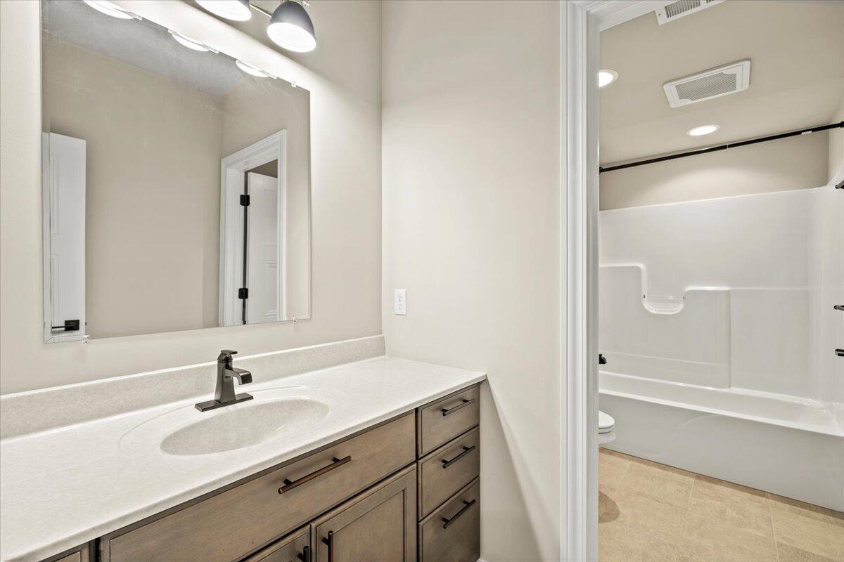 12893 Baker Court Crown Point, IN 46307 - Photo 41 of 52 a bathroom with a sink and a mirror