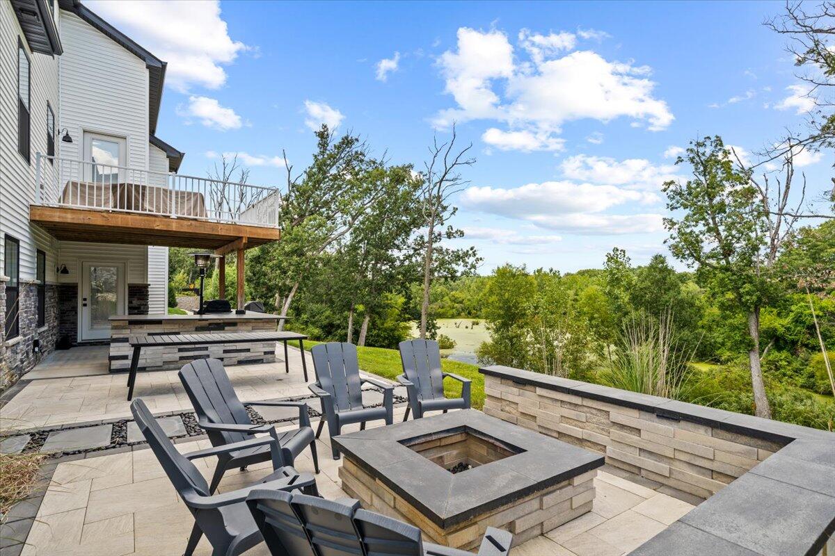 12893 Baker Court Crown Point, IN 46307 - Photo 45 of 52 a view of a patio with table and chairs and potted plants