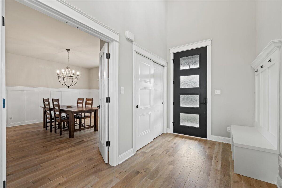 12893 Baker Court Crown Point, IN 46307 - Photo 6 of 52 a view of a dining room with furniture and wooden floor