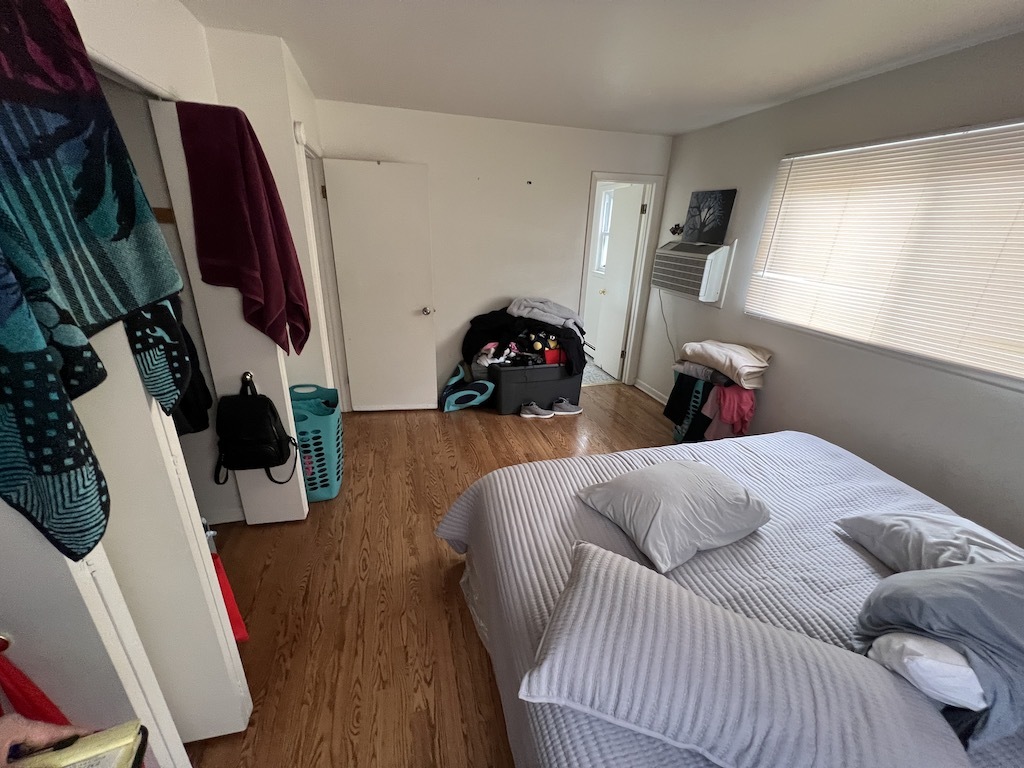 568 Ida Court Mount Prospect, IL 60056 - Photo 15 of 25 a bedroom with a bed and a flat tv screen