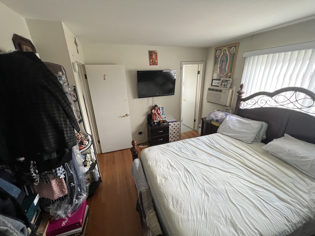 568 Ida Court Mount Prospect, IL 60056 - Photo 23 of 25 a bedroom with bed and flat screen tv