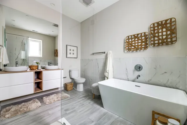 a spacious bathroom with a bathtub and a sink
