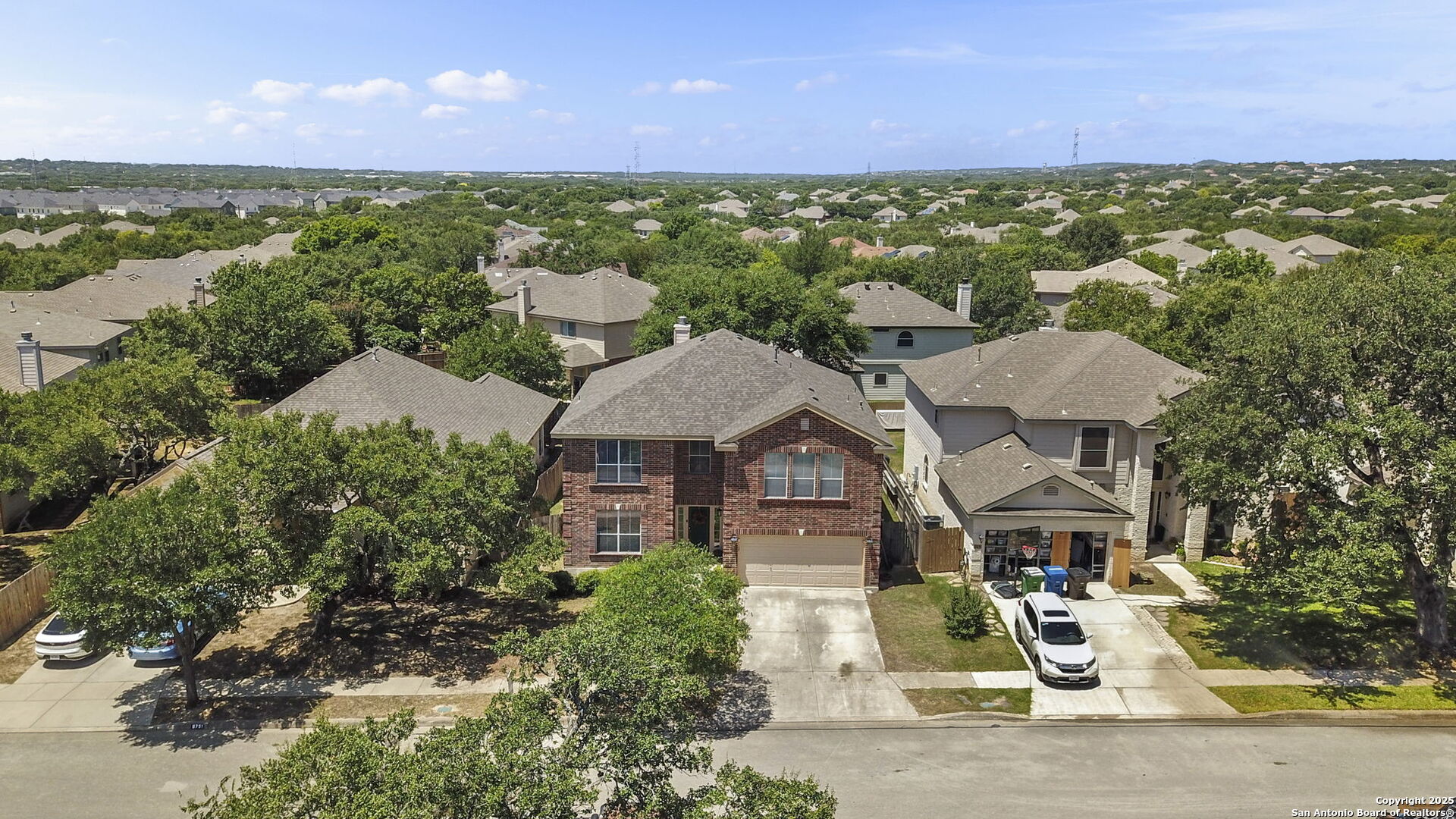 8747 Feather Trail Helotes, TX 78023 - Photo 1 of 34 a view of a city with palm trees