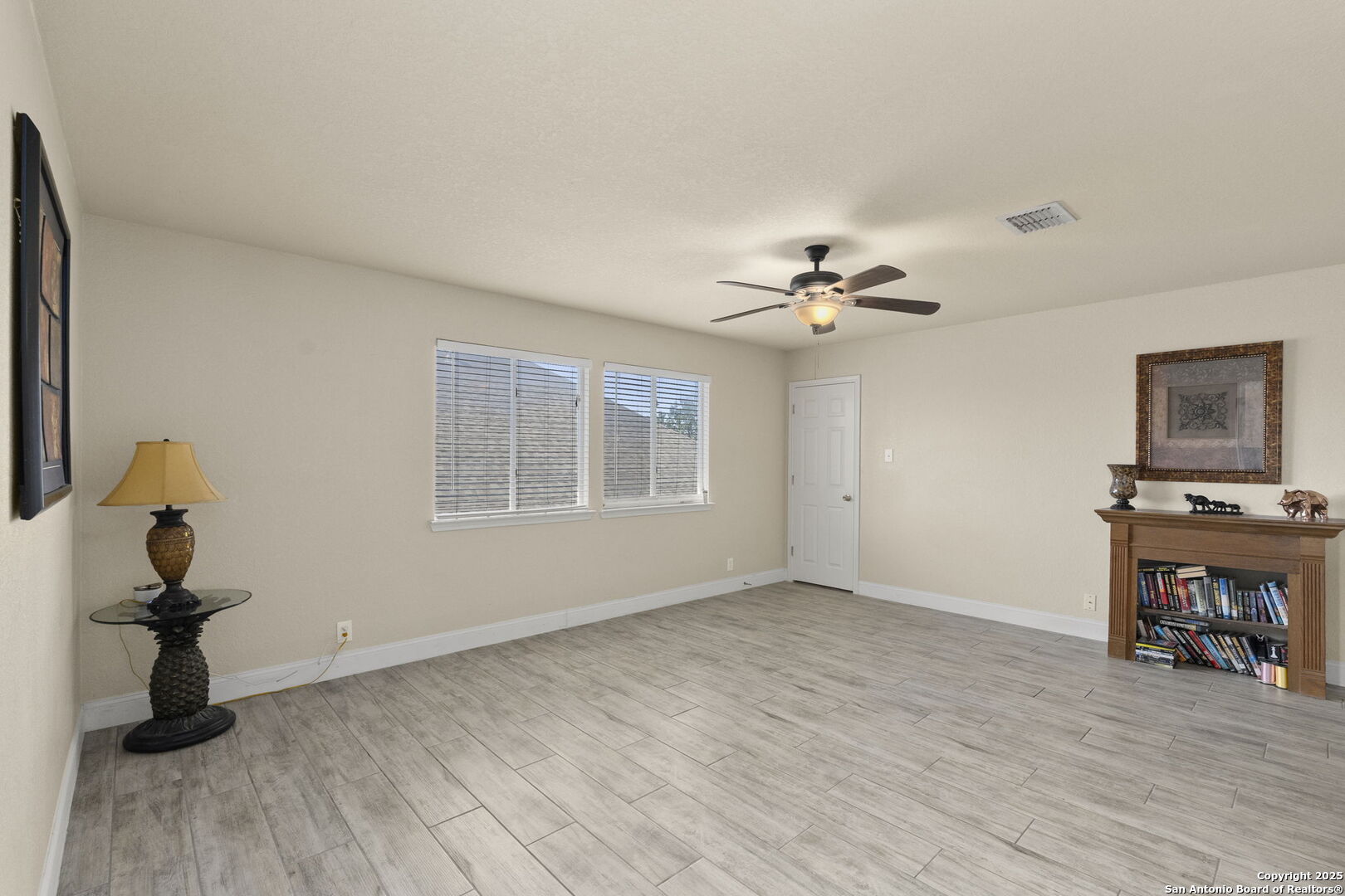 8747 Feather Trail Helotes, TX 78023 - Photo 11 of 34 a view of a livingroom and a window