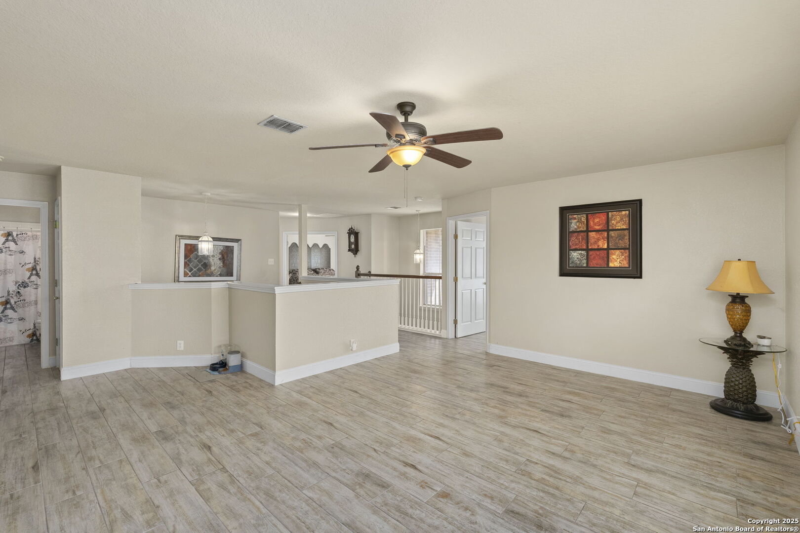 8747 Feather Trail Helotes, TX 78023 - Photo 12 of 34 a view of a workspace with furniture and wooden floor