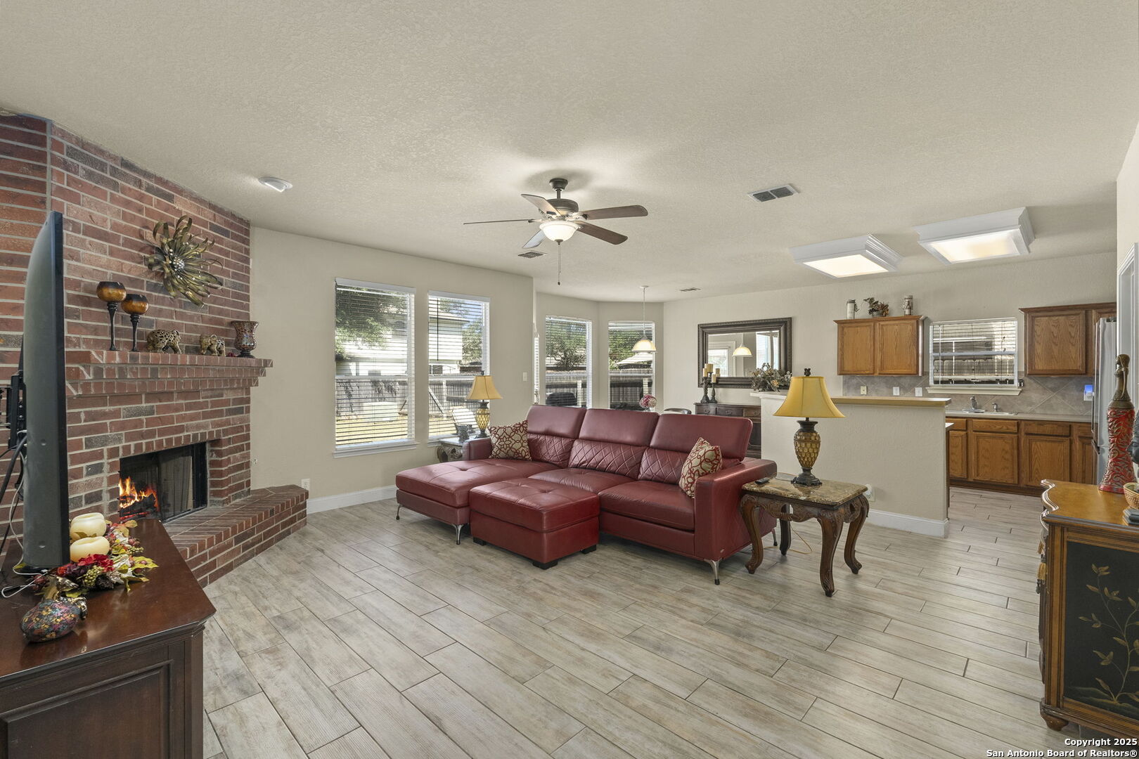 8747 Feather Trail Helotes, TX 78023 - Photo 14 of 34 a living room with furniture fireplace and window