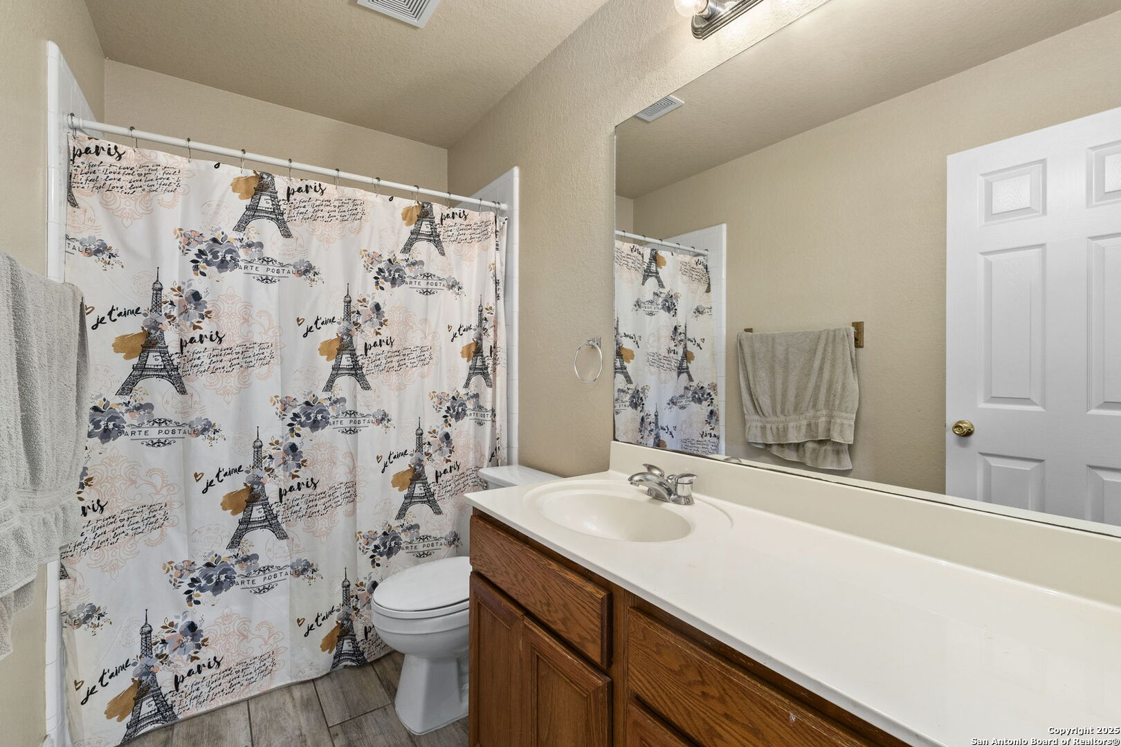 8747 Feather Trail Helotes, TX 78023 - Photo 28 of 34 a bathroom with a sink toilet and shower