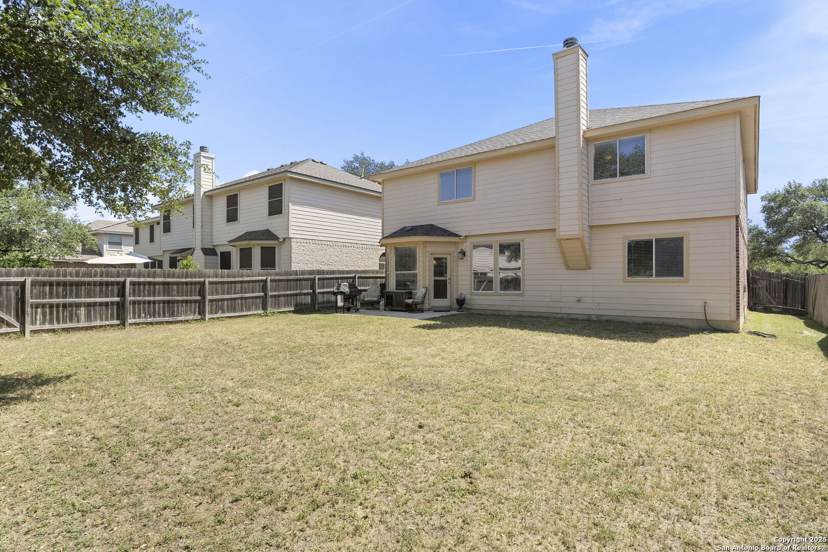 8747 Feather Trail Helotes, TX 78023 - Photo 31 of 34 a front view of a house with a yard