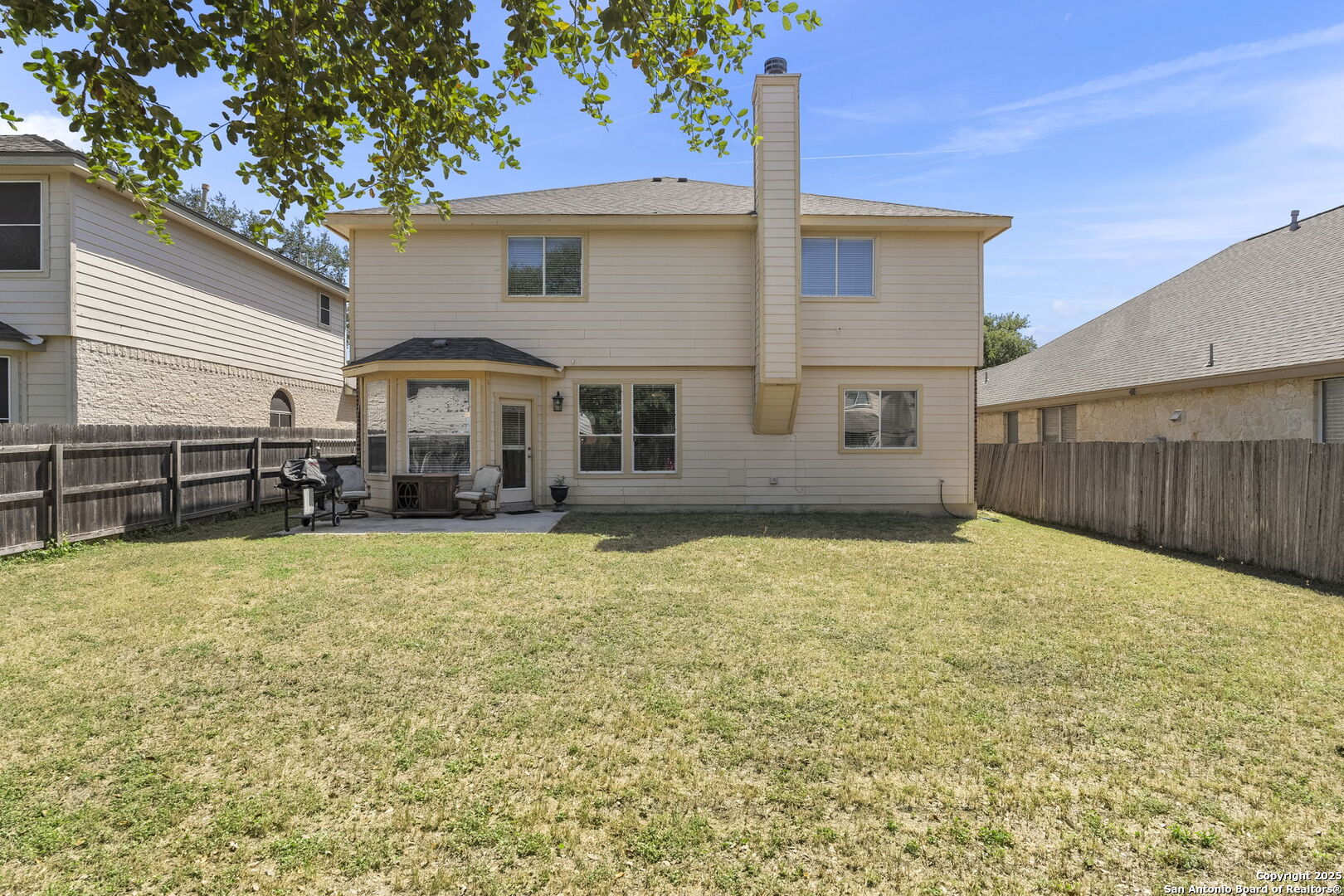 8747 Feather Trail Helotes, TX 78023 - Photo 32 of 34 a front view of a house with a yard