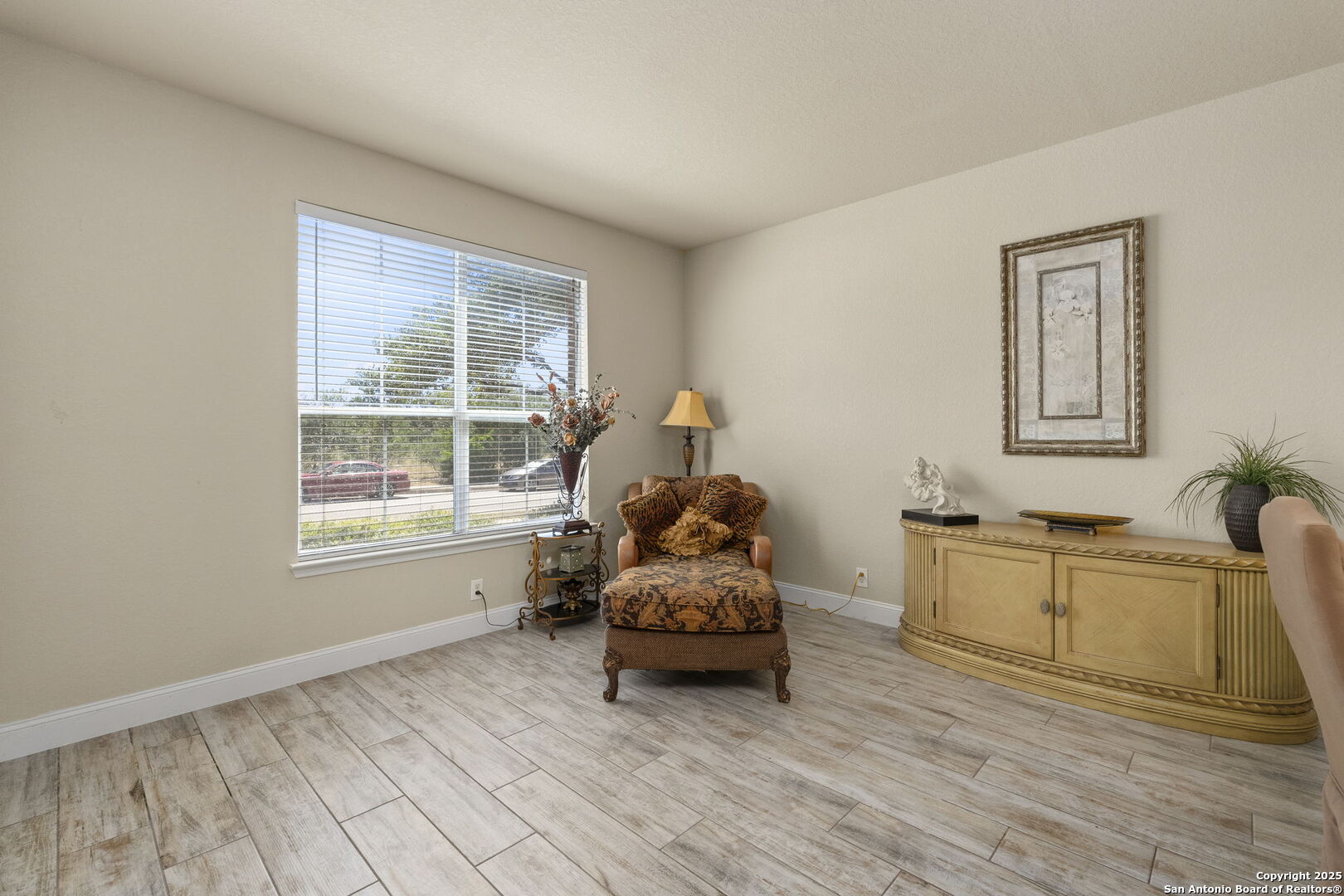 8747 Feather Trail Helotes, TX 78023 - Photo 9 of 34 a living room with furniture and wooden floor