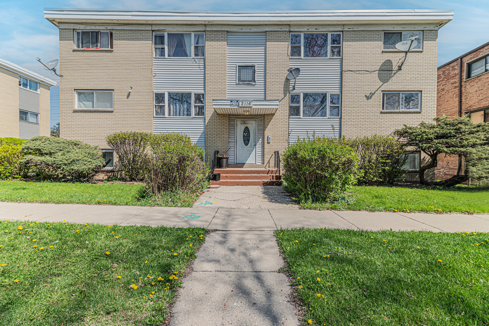2101 Williamsburg Drive Waukegan, IL 60085 - Photo 1 of 25 a front view of a house with garden and plants
