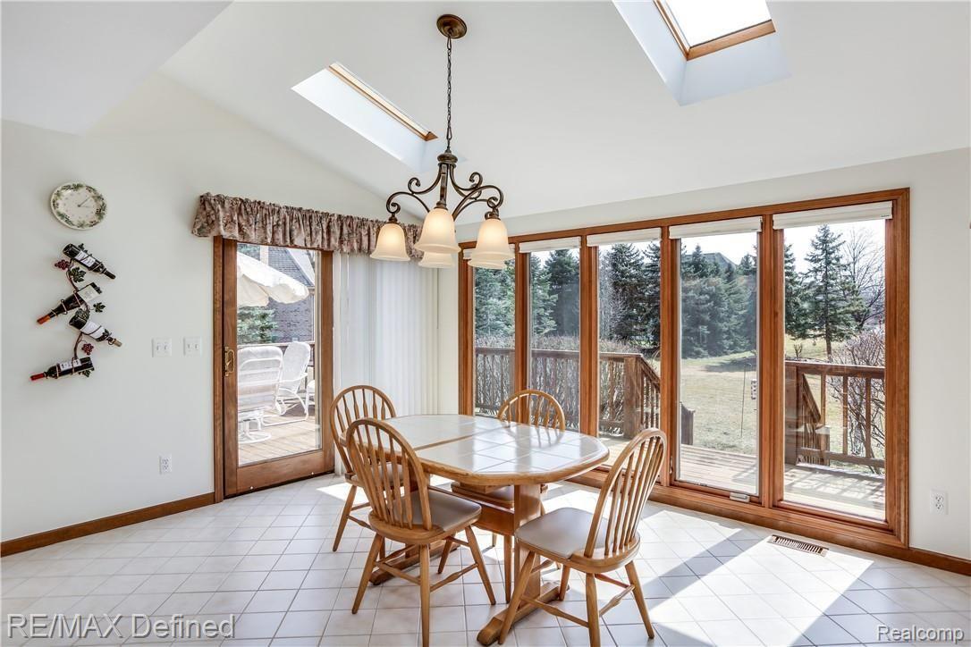4140 Ridge Side Drive Rochester, MI 48306 - Photo 6 of 42 Two large skylights in the kitchen and a large doorwall to the spacious deck.