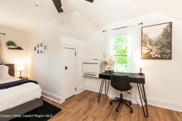 a workspace with furniture and a window