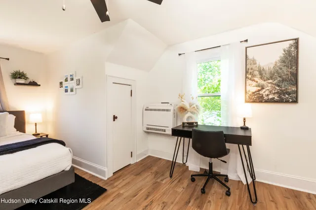 a workspace with furniture and a window