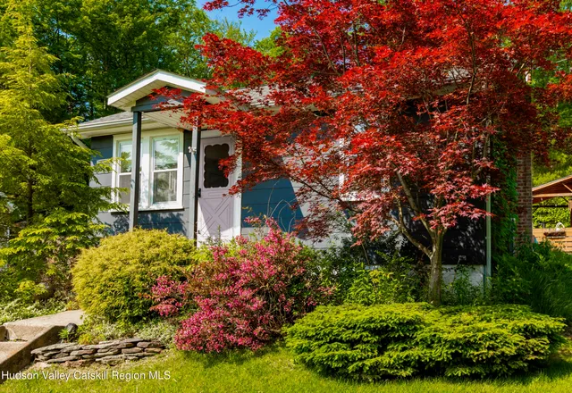 front view of a house with a yard