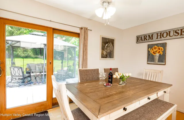 a view of a dining room with furniture window and outside view