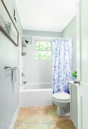 a bathroom with a toilet a sink and a bathtub