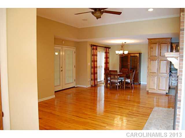 104 Provincial Road Gastonia, NC 28056 - Photo 2 of 12 a view of dining room with kitchen view and wooden floor