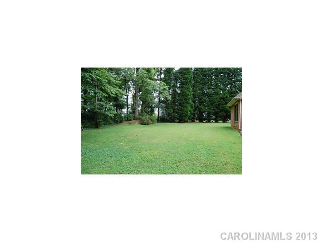 104 Provincial Road Gastonia, NC 28056 - Photo 12 of 12 a picture of a bench in a field