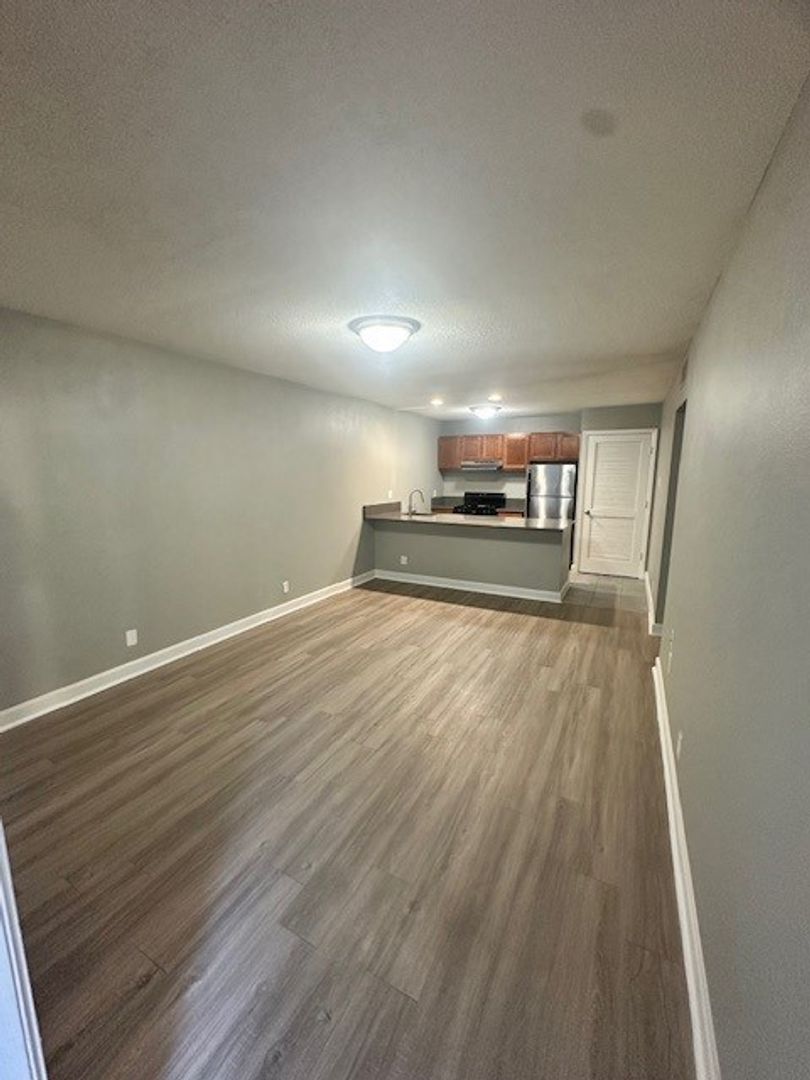 2520 Longview Street, Unit 405 Austin, TX 78705 - Photo 3 of 11 a view of a room with wooden floor