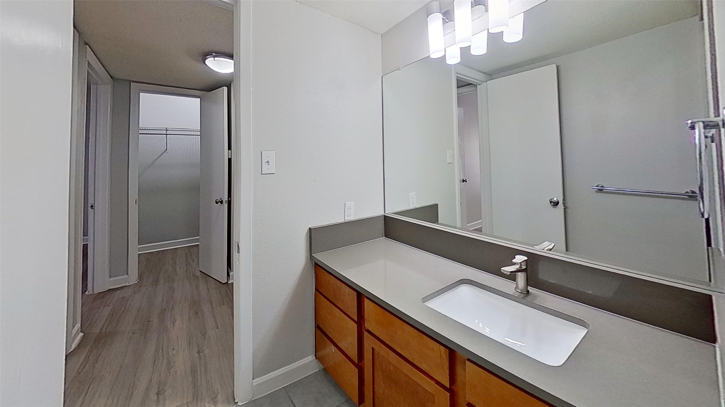 2520 Longview Street, Unit 405 Austin, TX 78705 - Photo 3 of 9 a bathroom with a sink double vanity and a mirror
