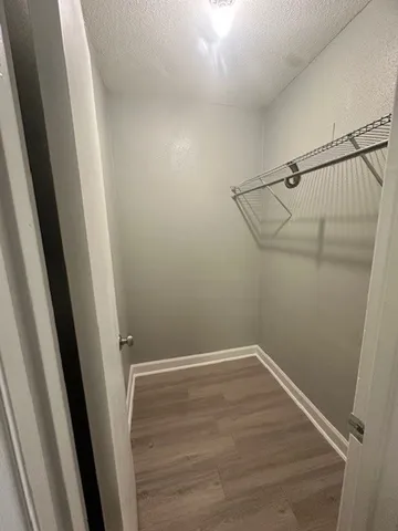 a view of a room with racks on the wall