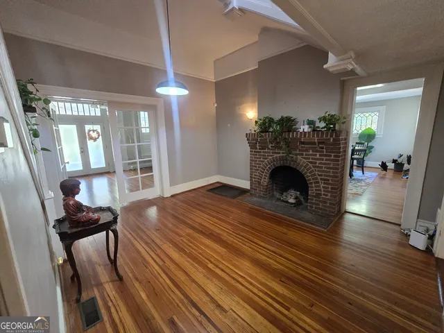 a view of livingroom with furniture fireplace and hardwood floor