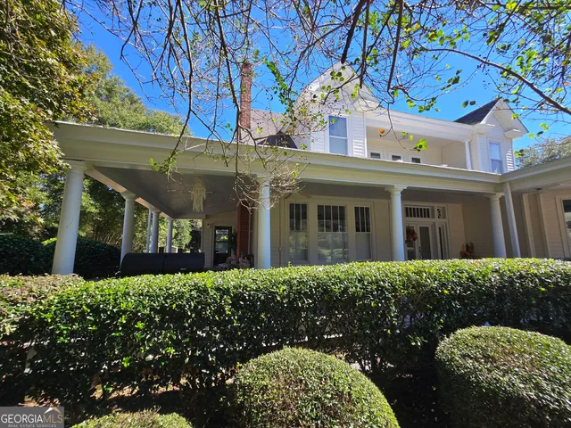 a view of a house with a garden